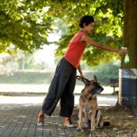 woman and dog in aprk