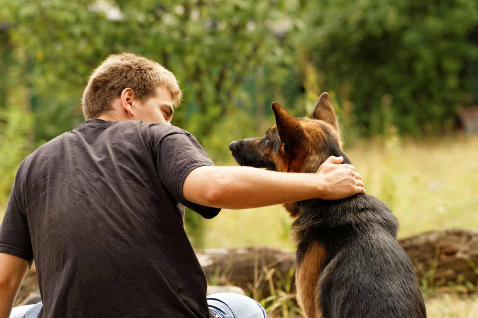 Photo of a beautiful friendship with a boy and a dog