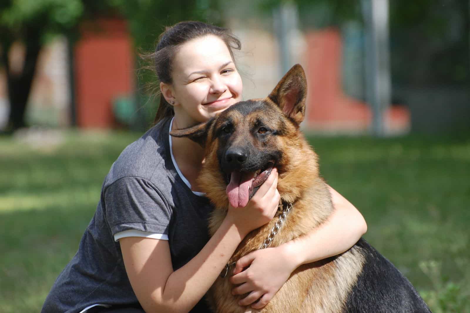 Teenager girl and German Shepherd dog