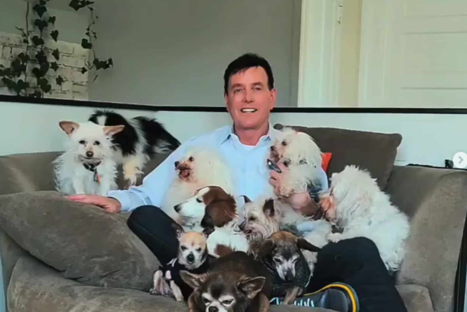 man with puppies