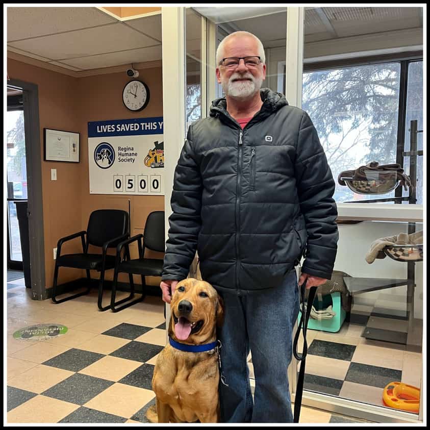 man with dog posing