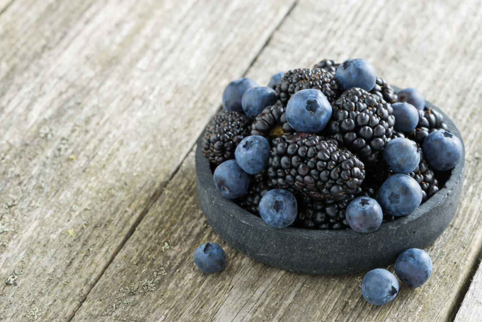 fresh blackberries and blueberries in a bowl