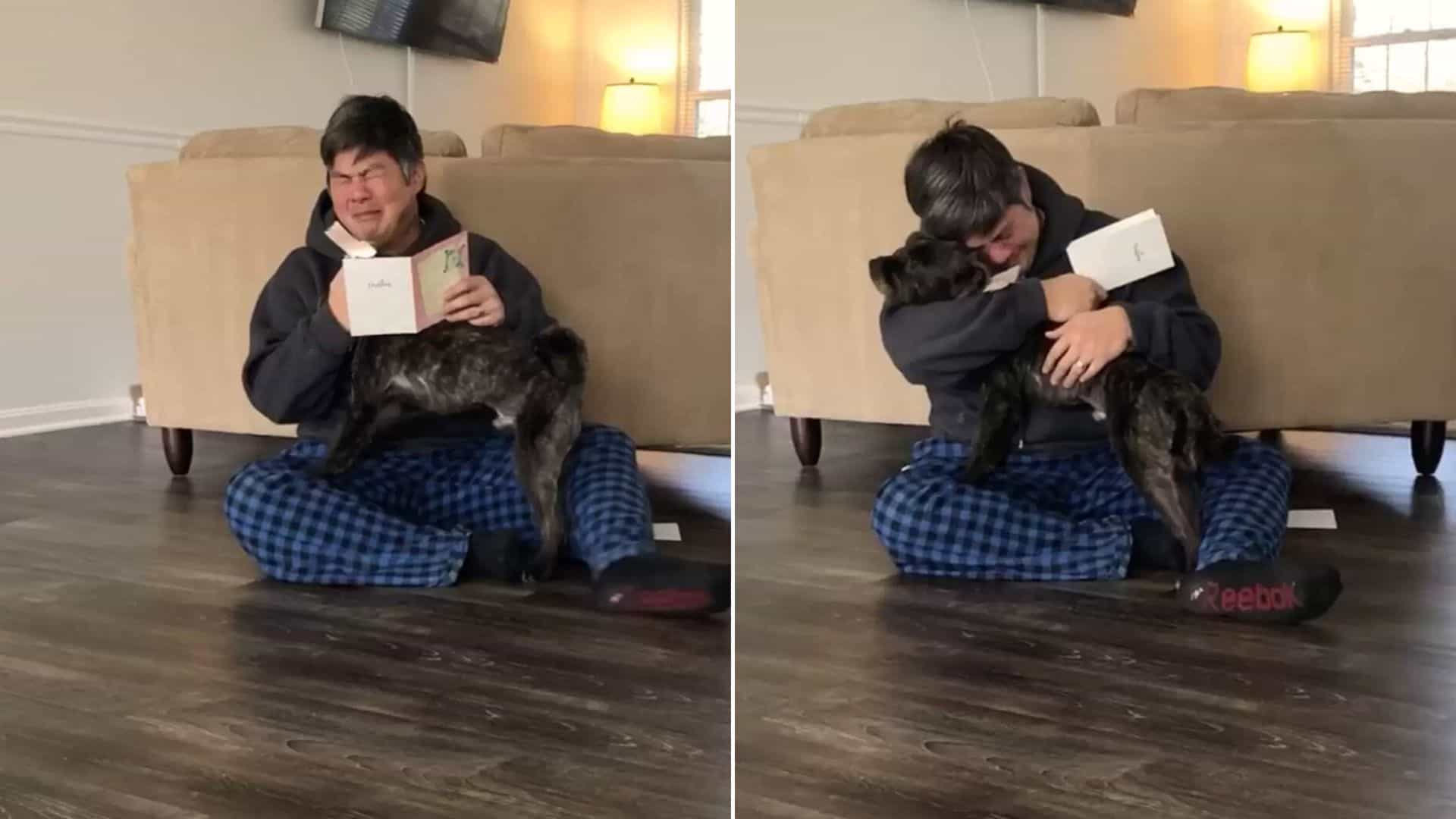 crying man hugging a dog