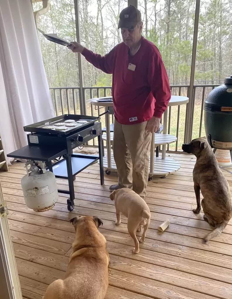 Watson with his foster dogs on a deck