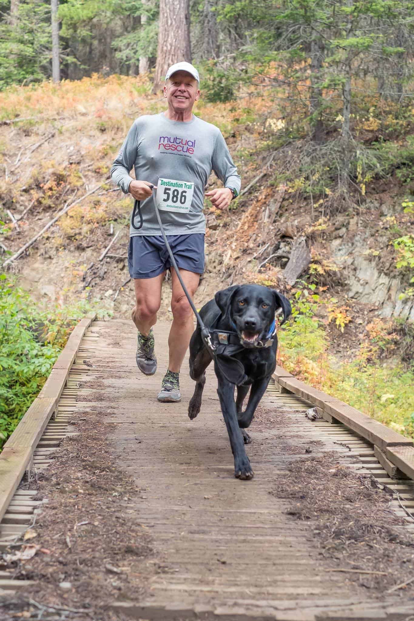 Man jogging with his dog