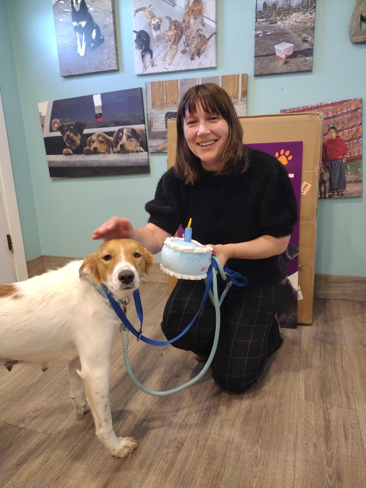 smiling woman with dog posing