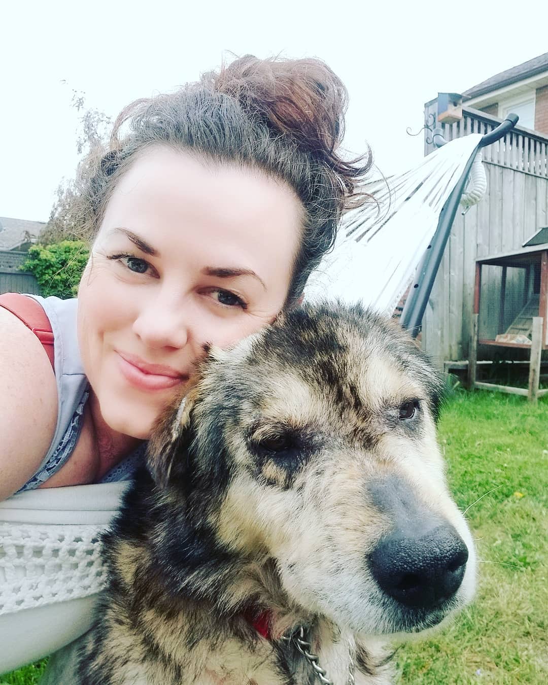 woman taking selfie with senior dog