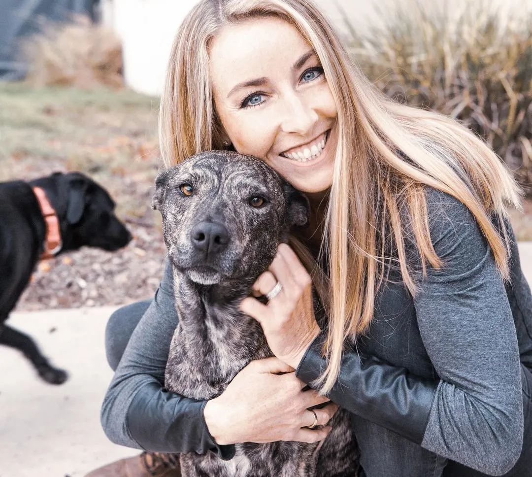 woman hugging the dog