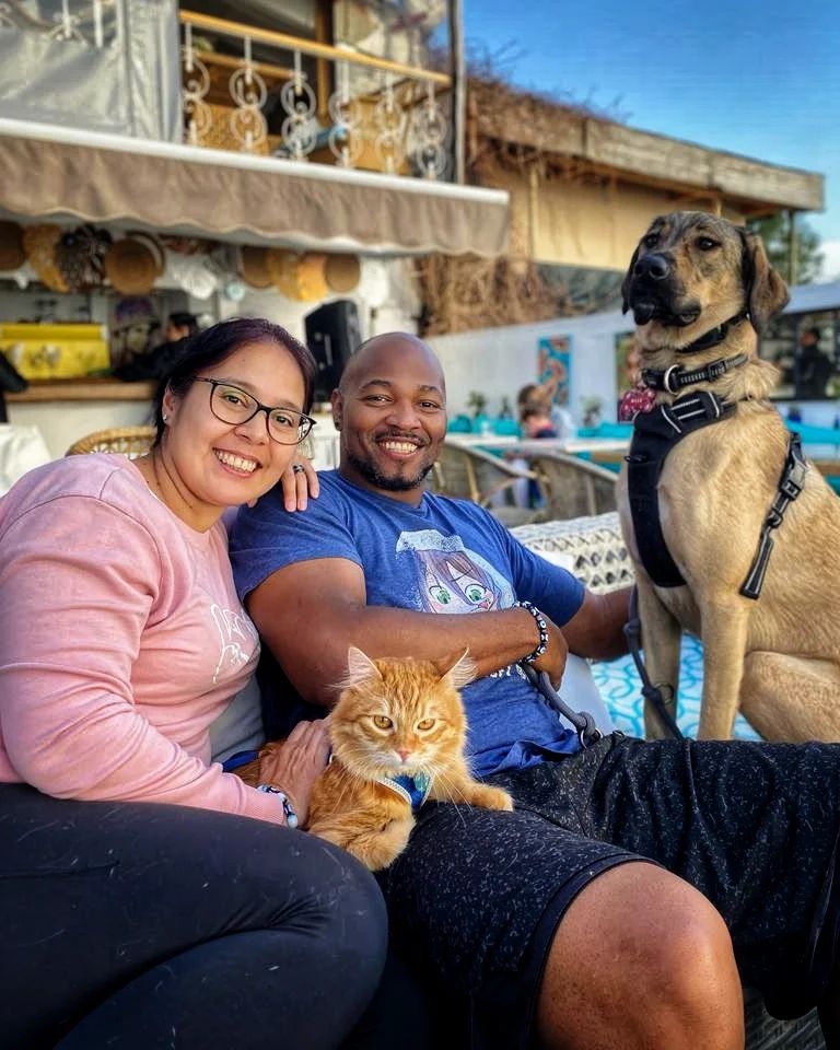 photo of a couple with cat and dog