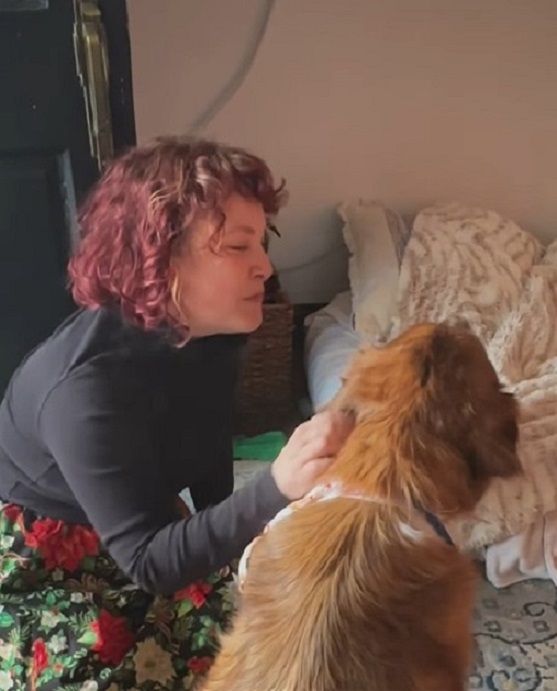 red headed woman and dog
