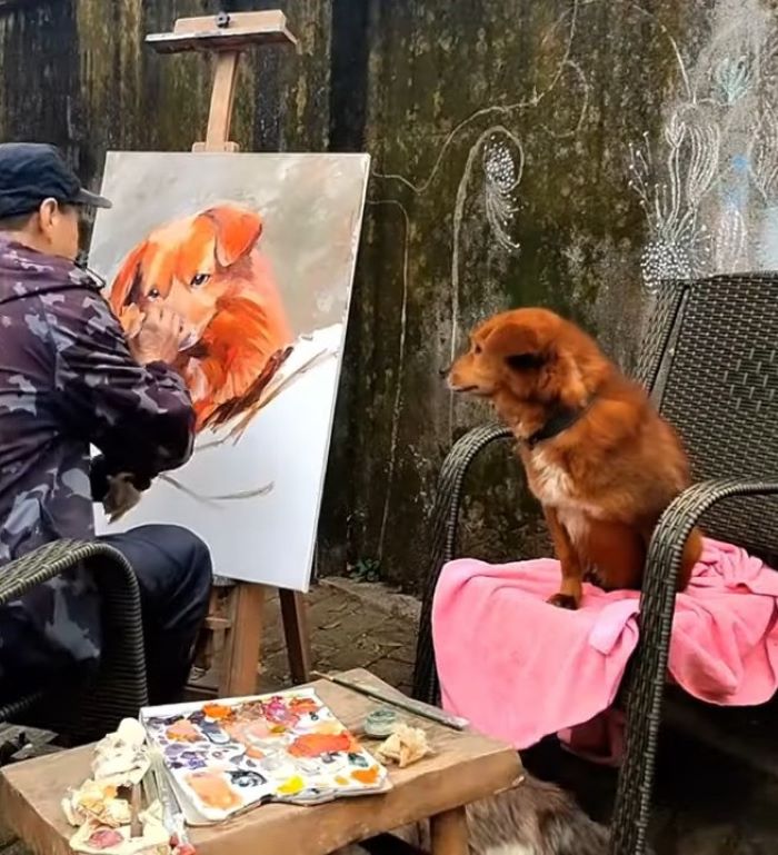 guy painting a dog