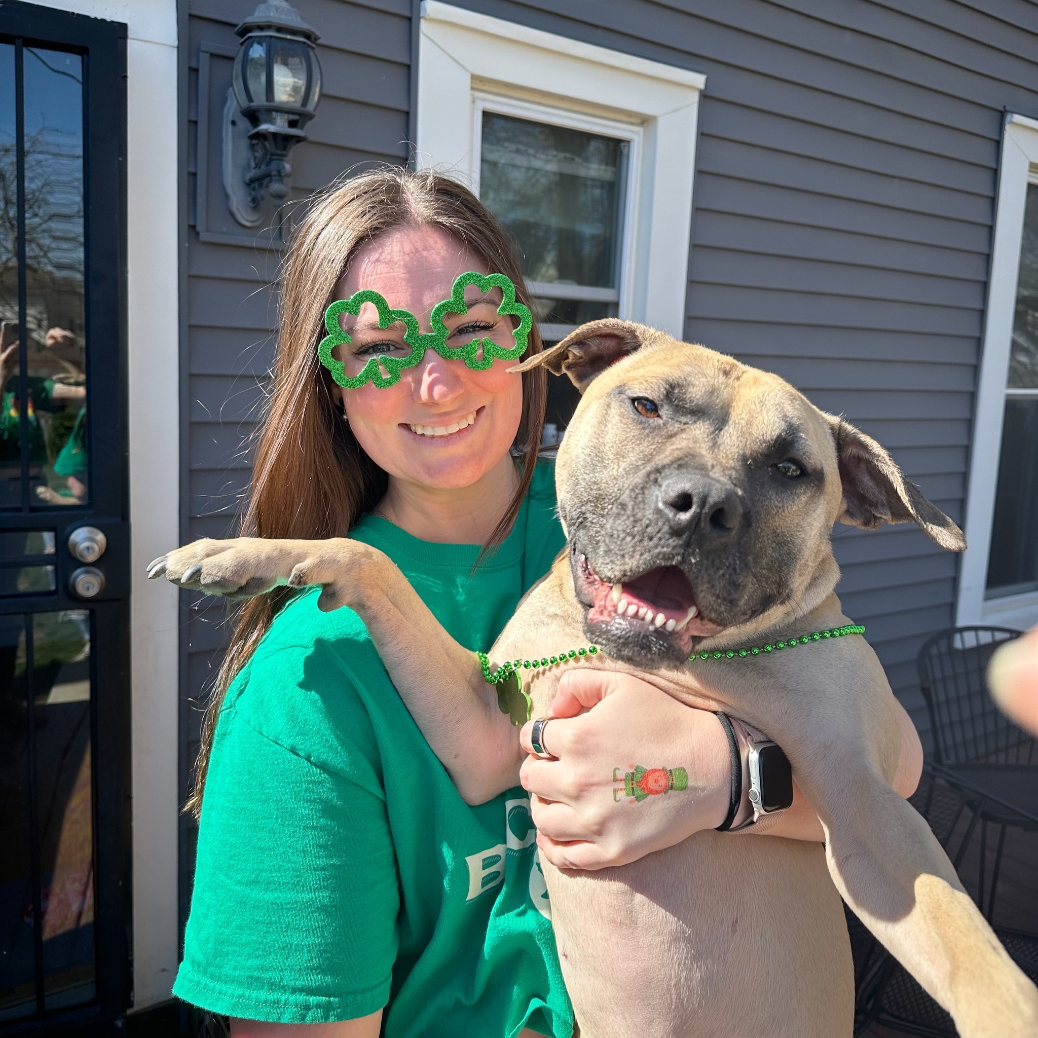 woman with green glasses and dog