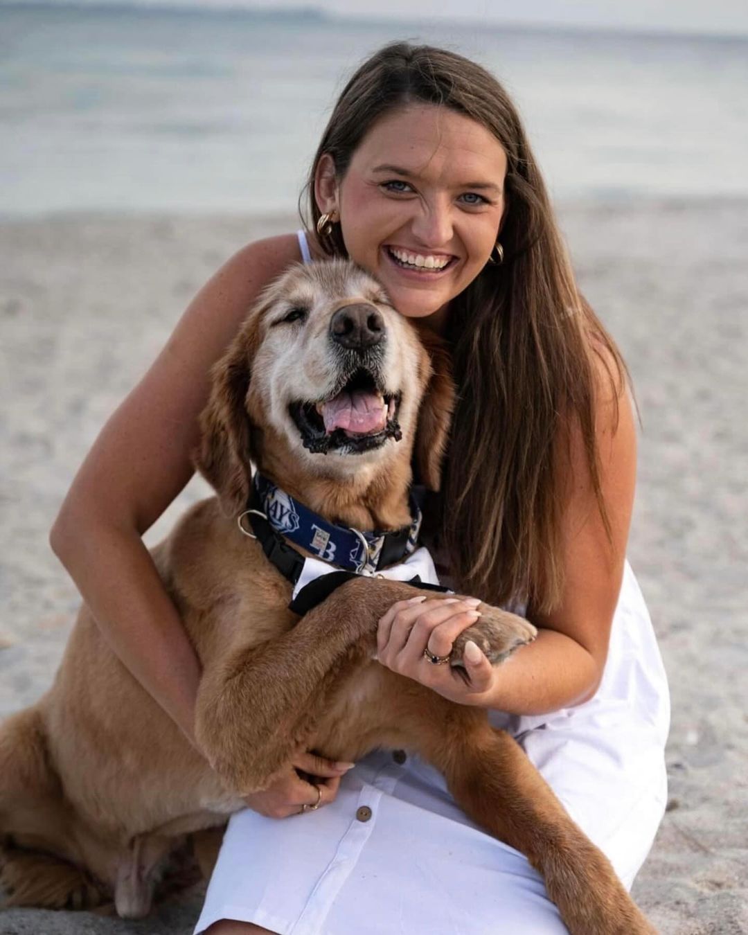 woman and dog on a beach