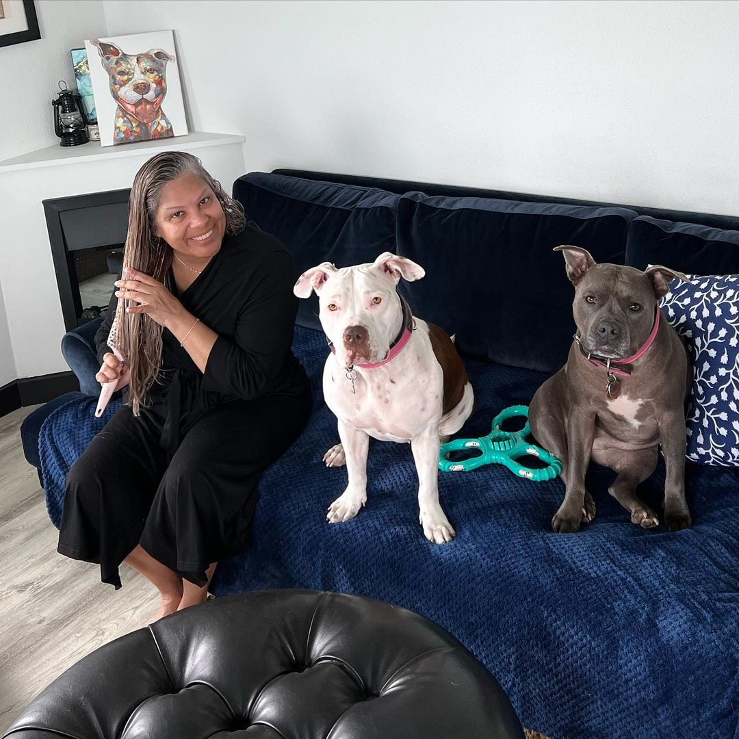 woman and two Pitbulls