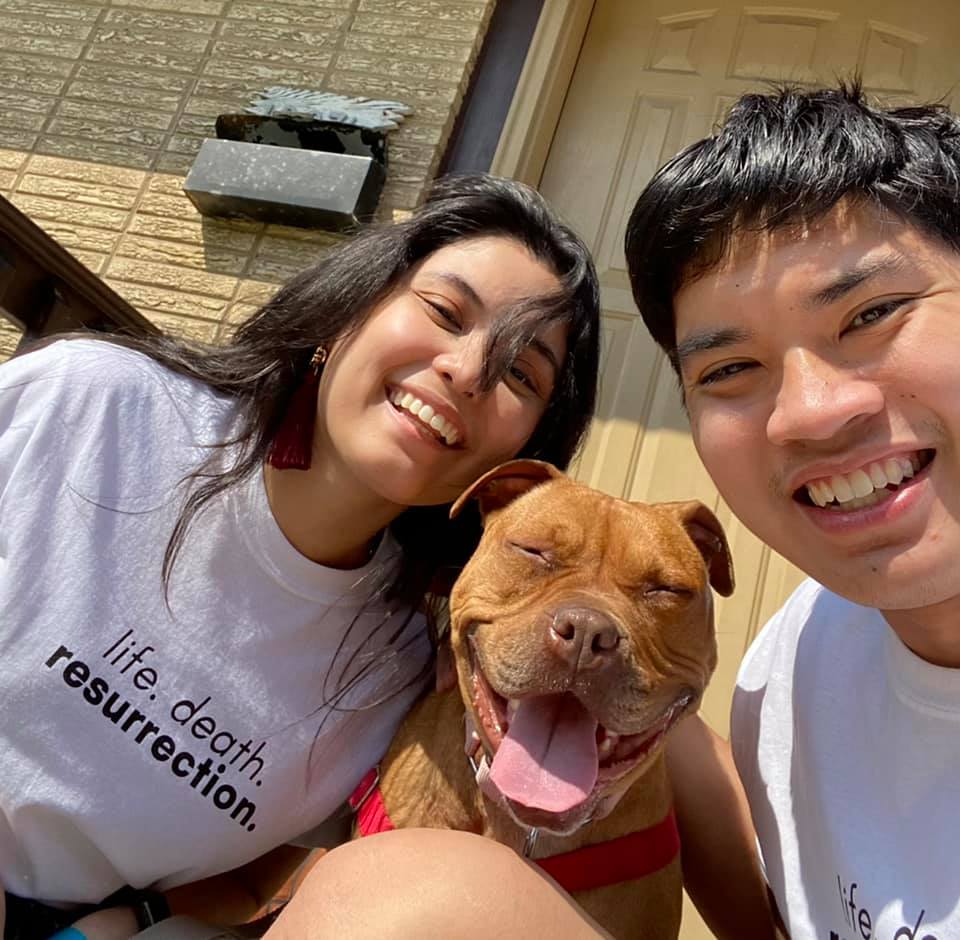 happy couple with dog