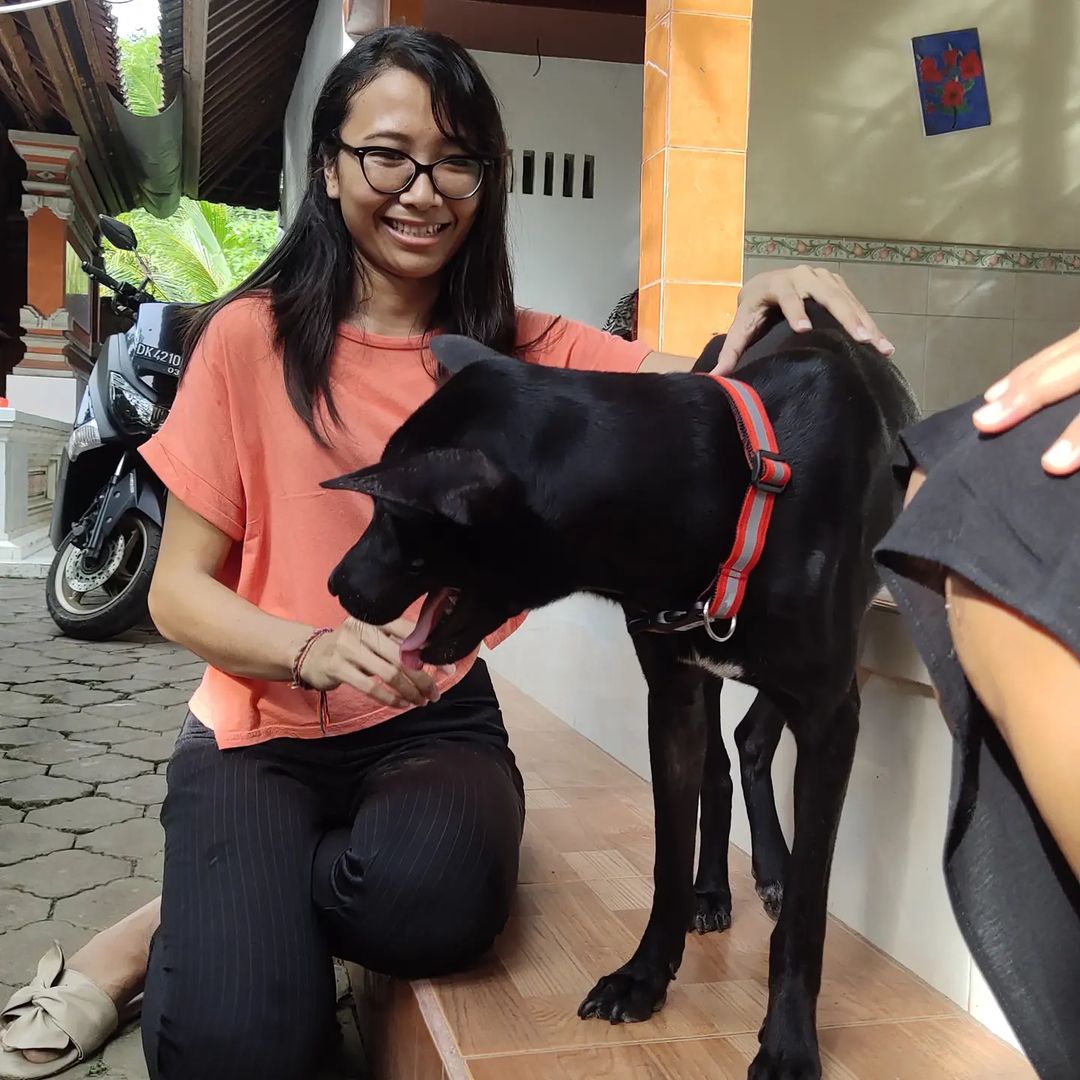 photo of woman and a dog