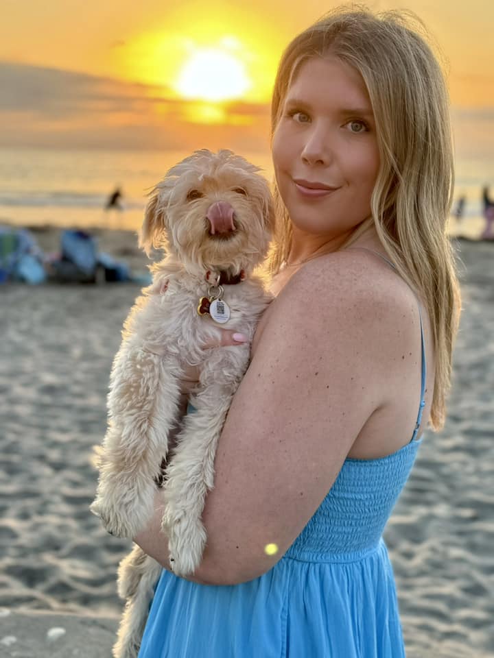 woman and dog at sunset