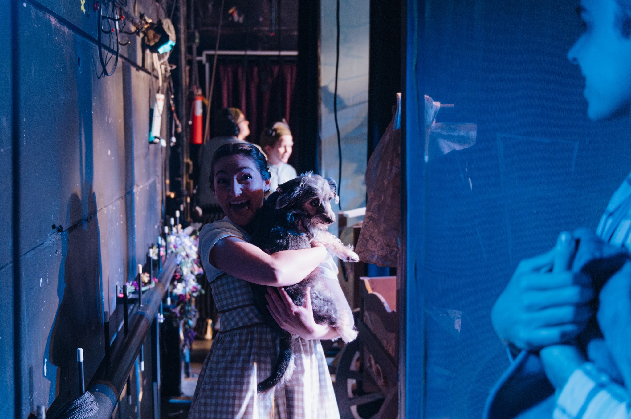 woman holding the dog in theatre