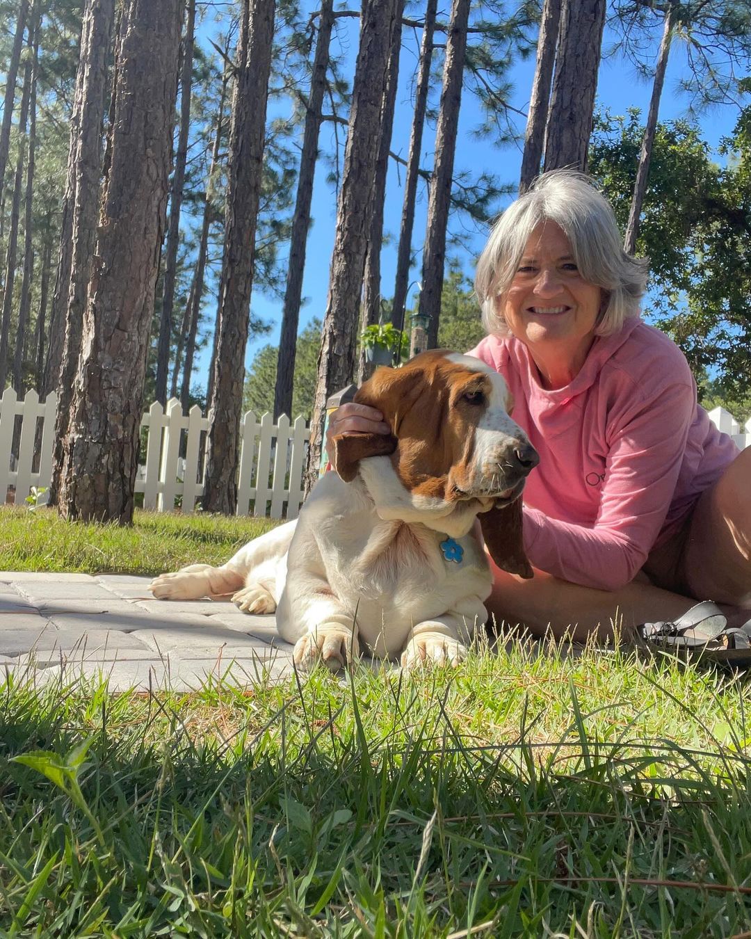 woman and basset hound dog