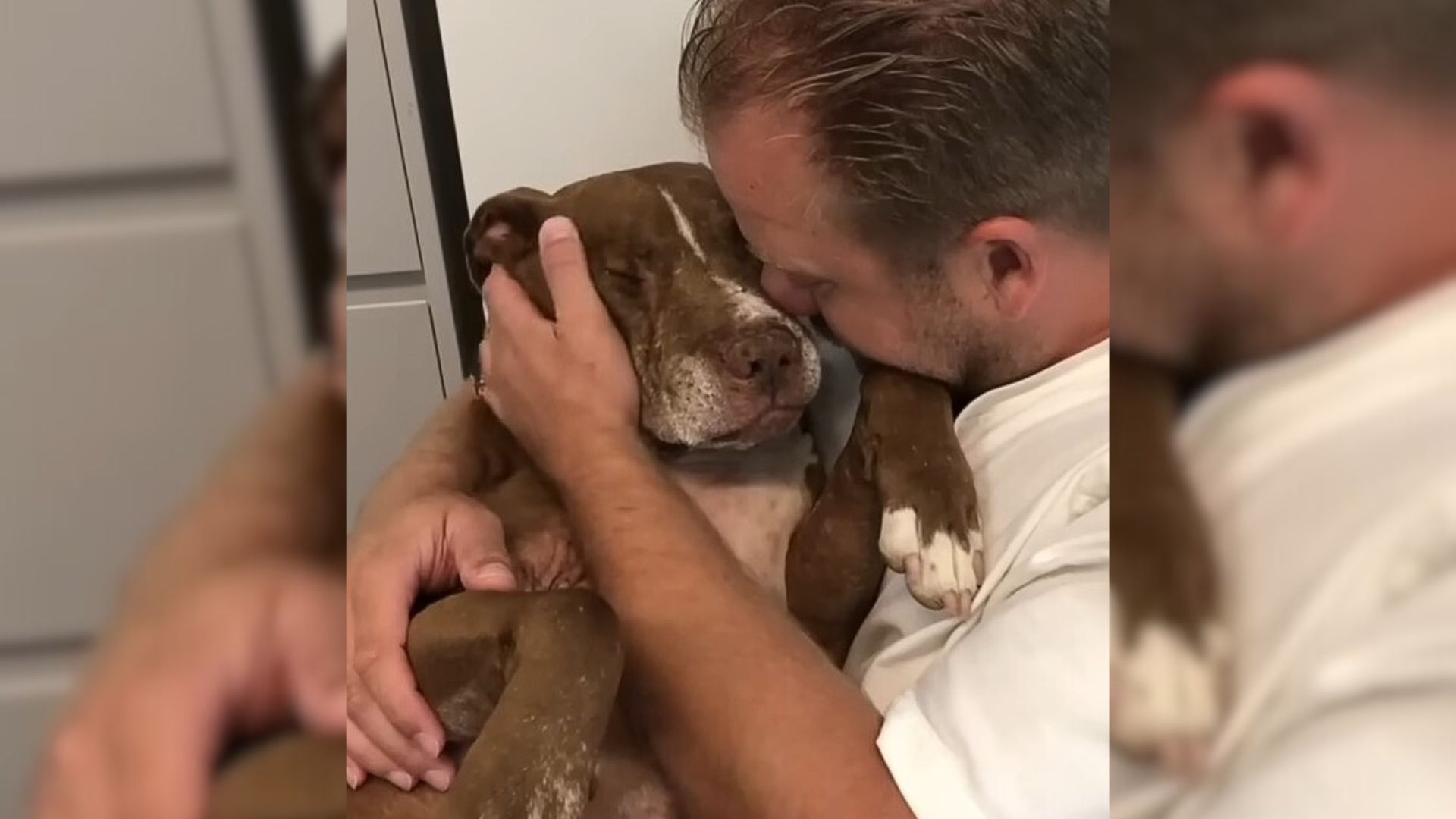 man holding abused pup