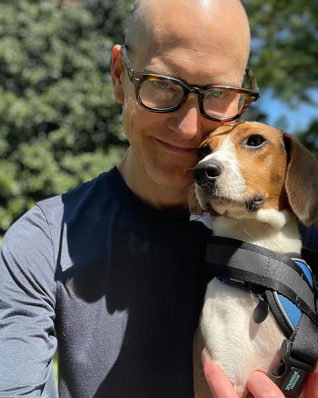 a man holding dog