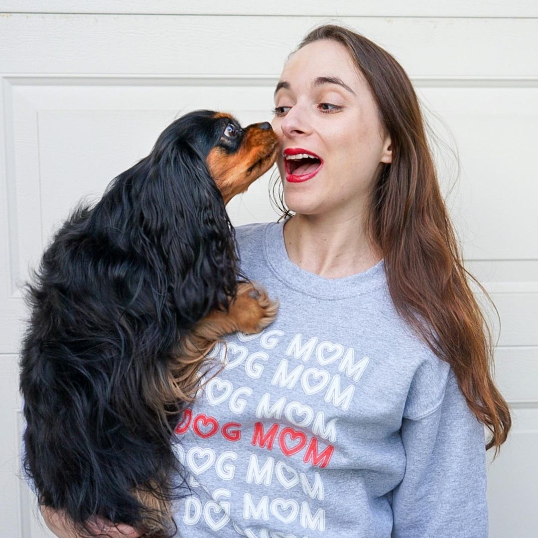 woman holding a dog