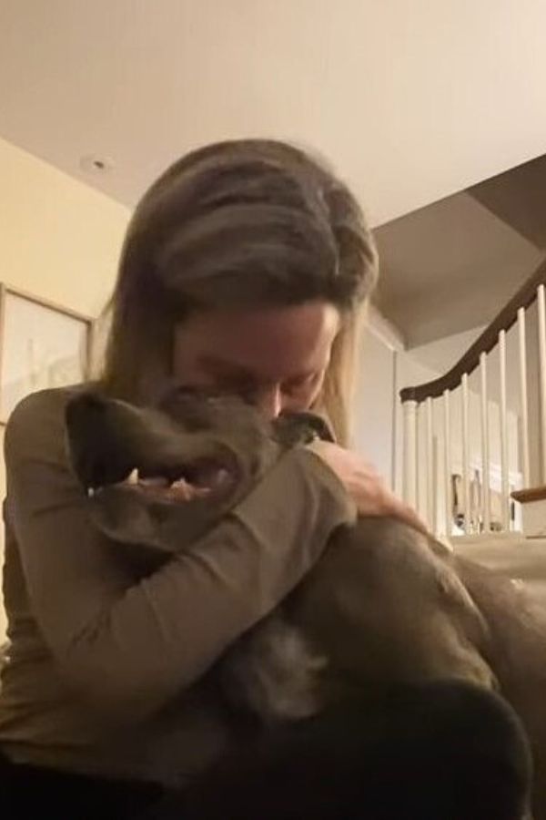 woman hugging a dog