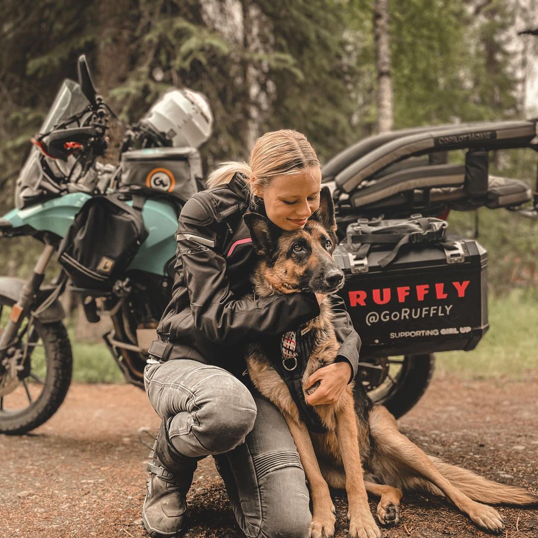 woman with bike and dog