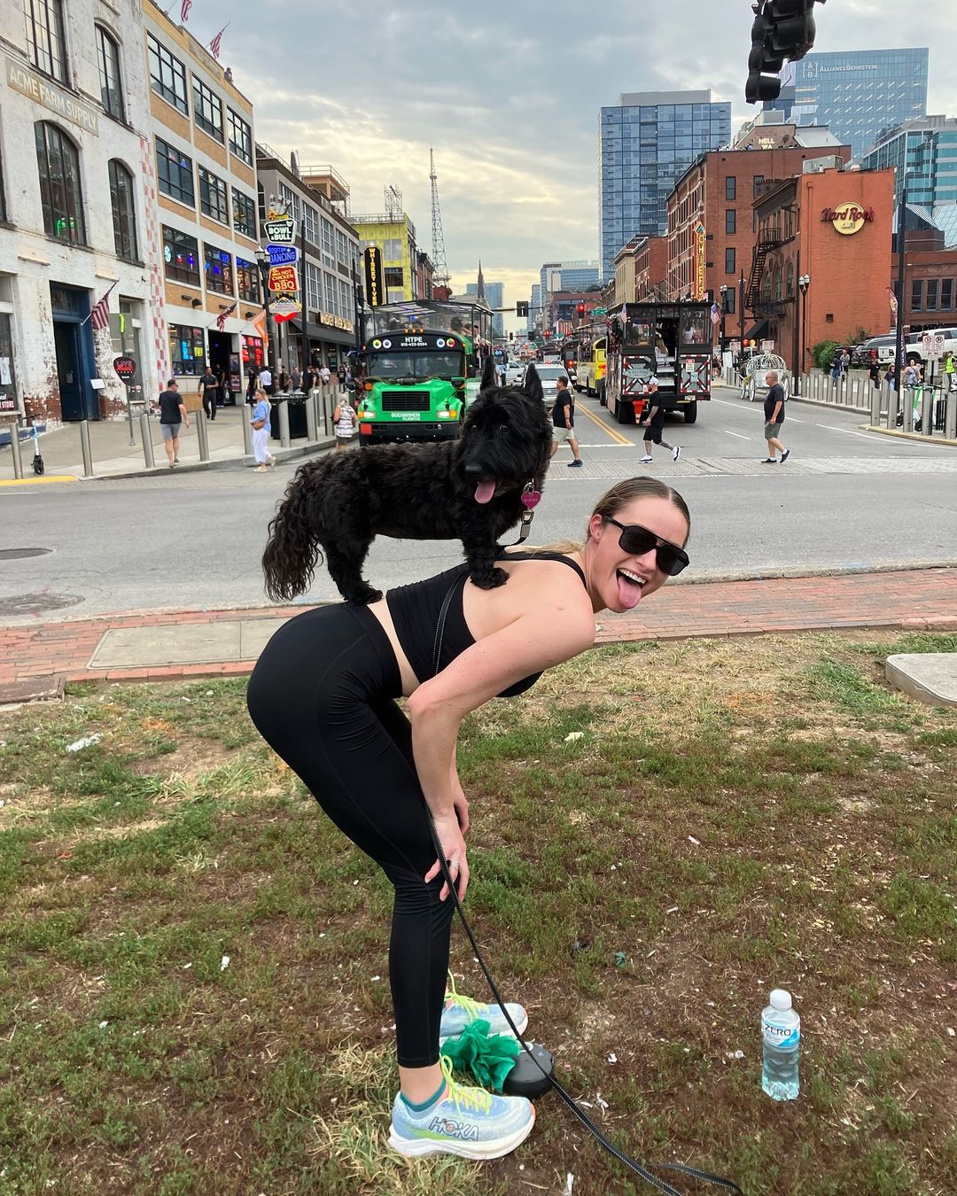 woman with black dog on back