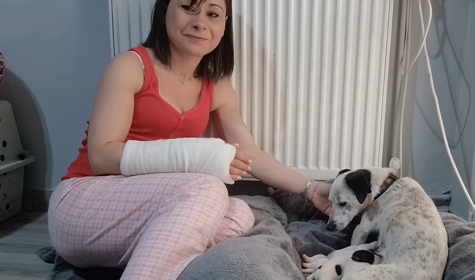 woman with broken hand and dog