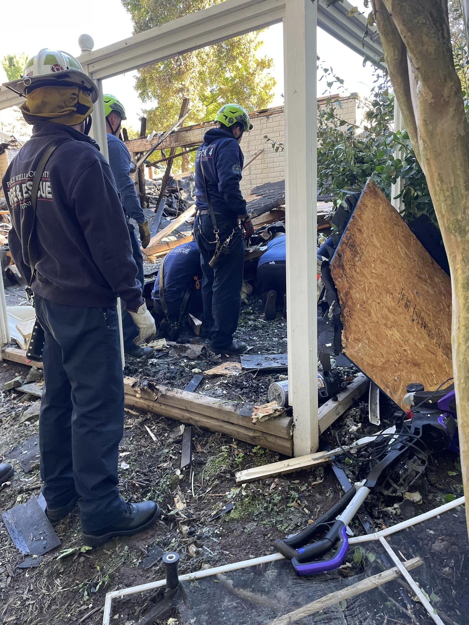 firefighters on rubble