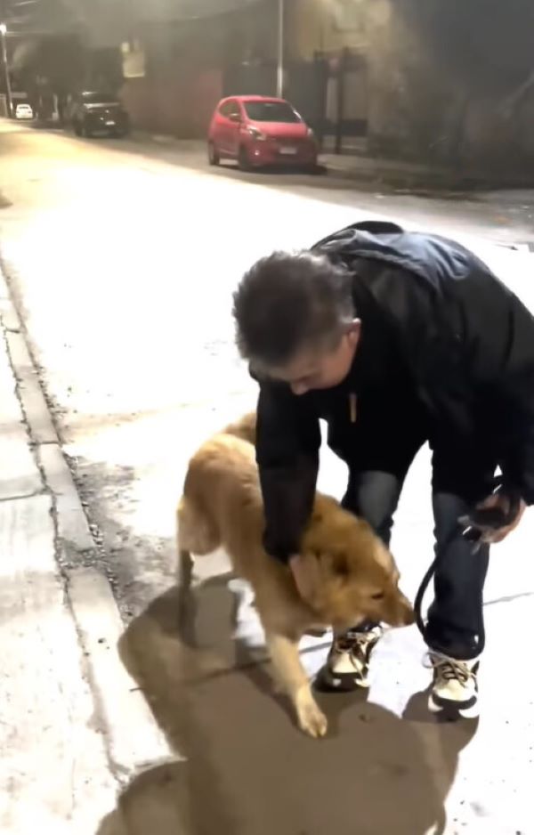 man and rescued dog