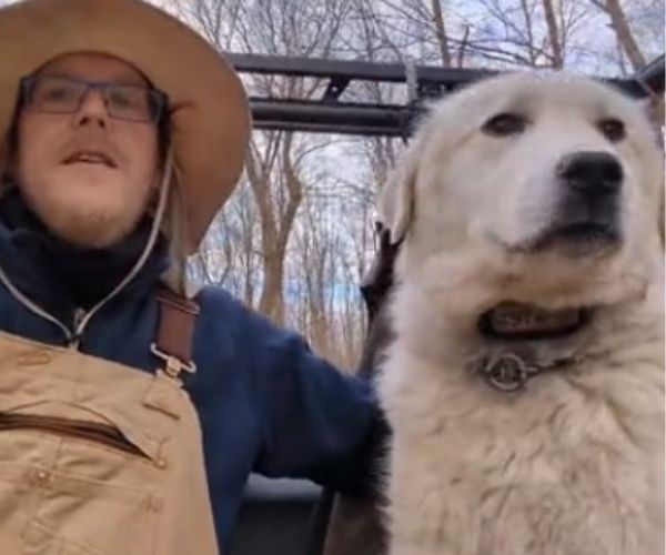 owner and white dog