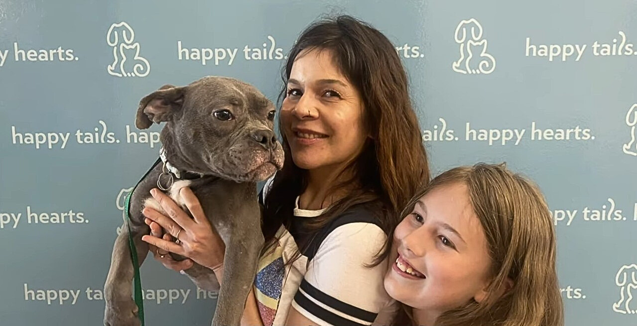 two girls and dog