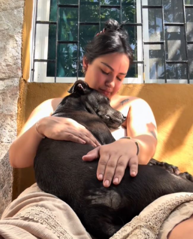 woman holding a dog