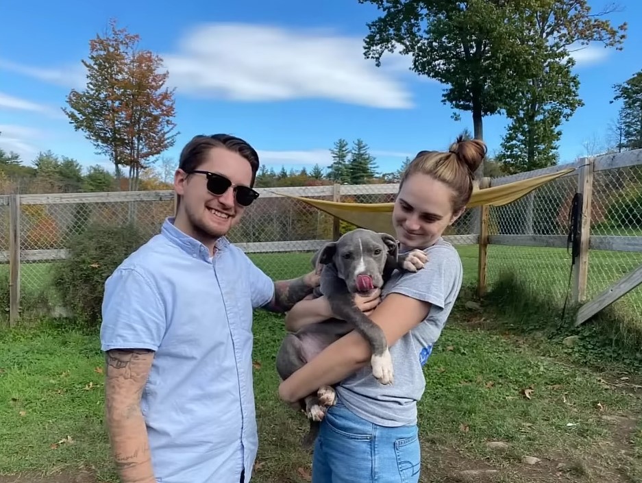 couple and gray puppy