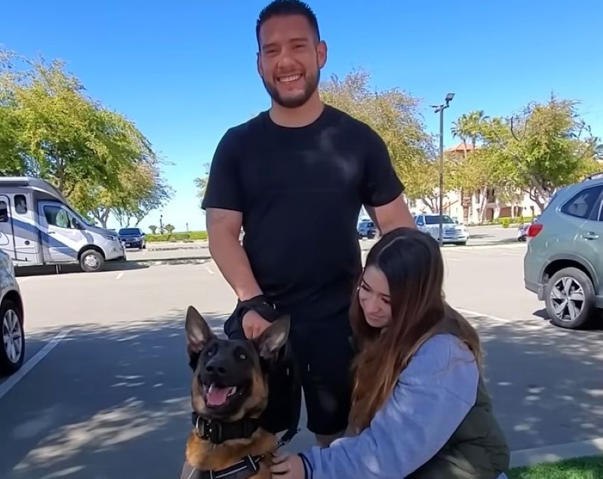 man and woman with a dog