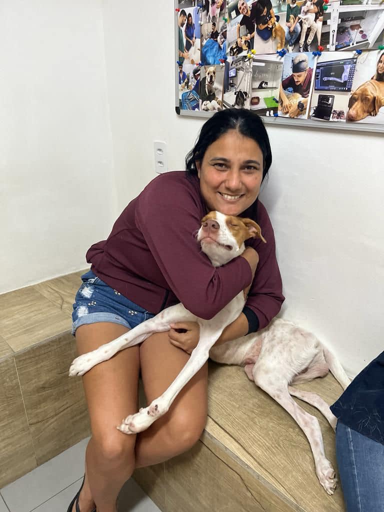 woman hugging a dog