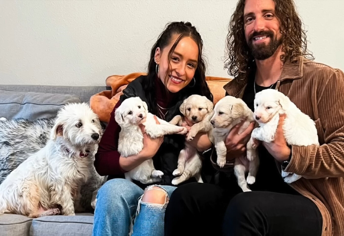 a girl and a man with their dogs