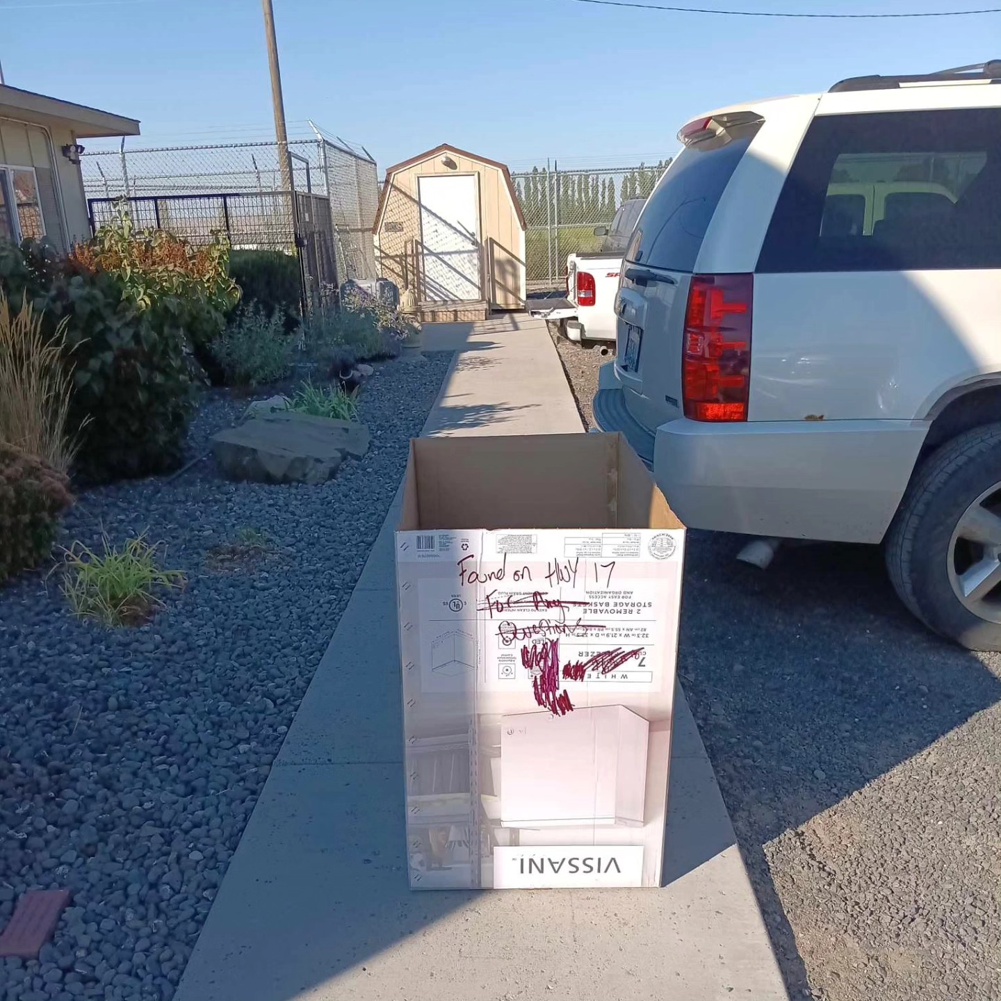 cardboard box on a sidewalk