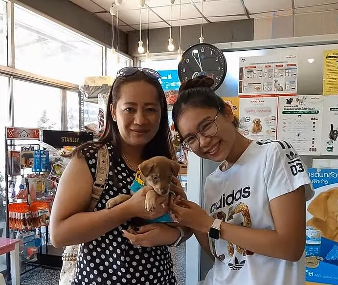 girl and woman with a puppy in their arms