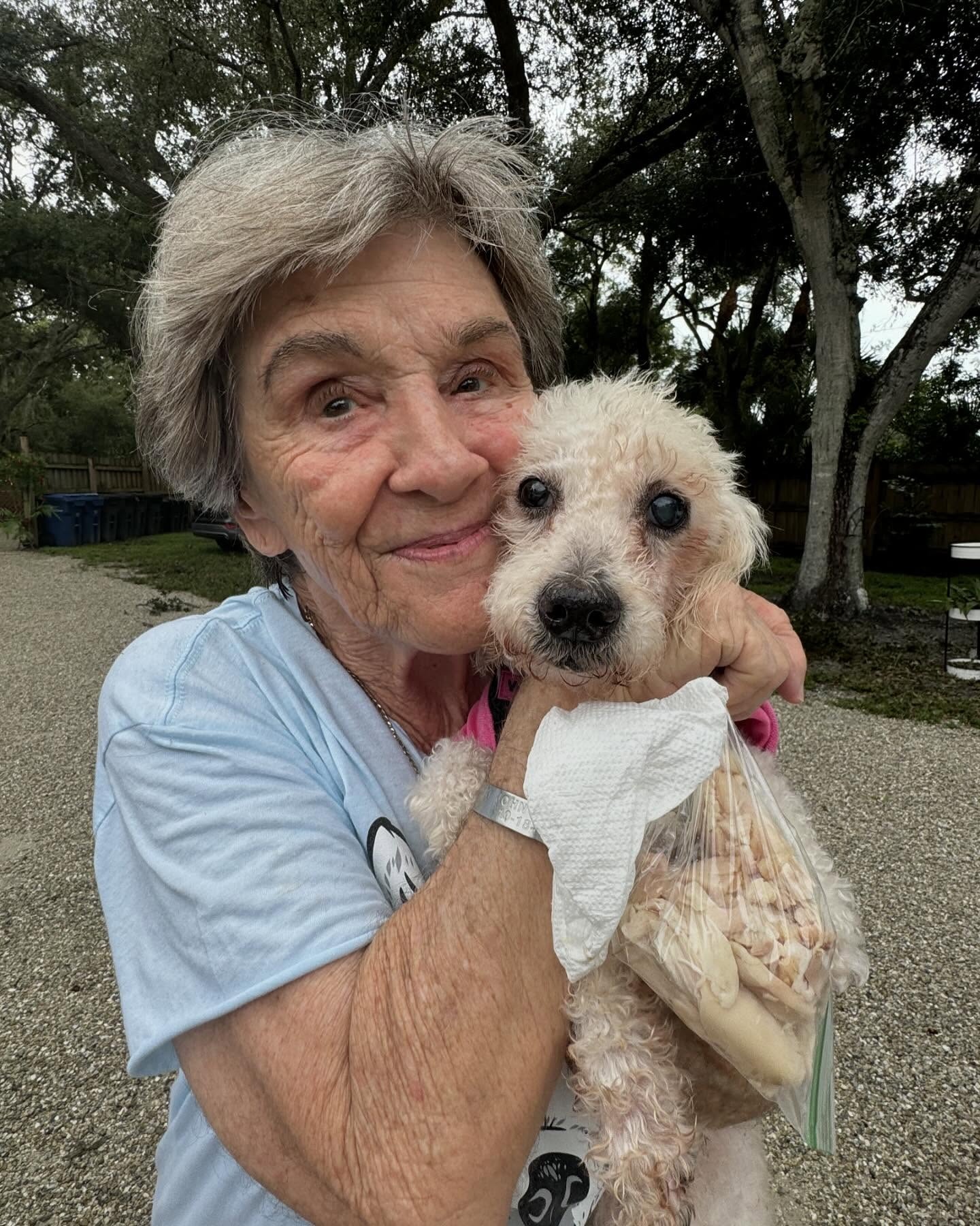 granny holding dog