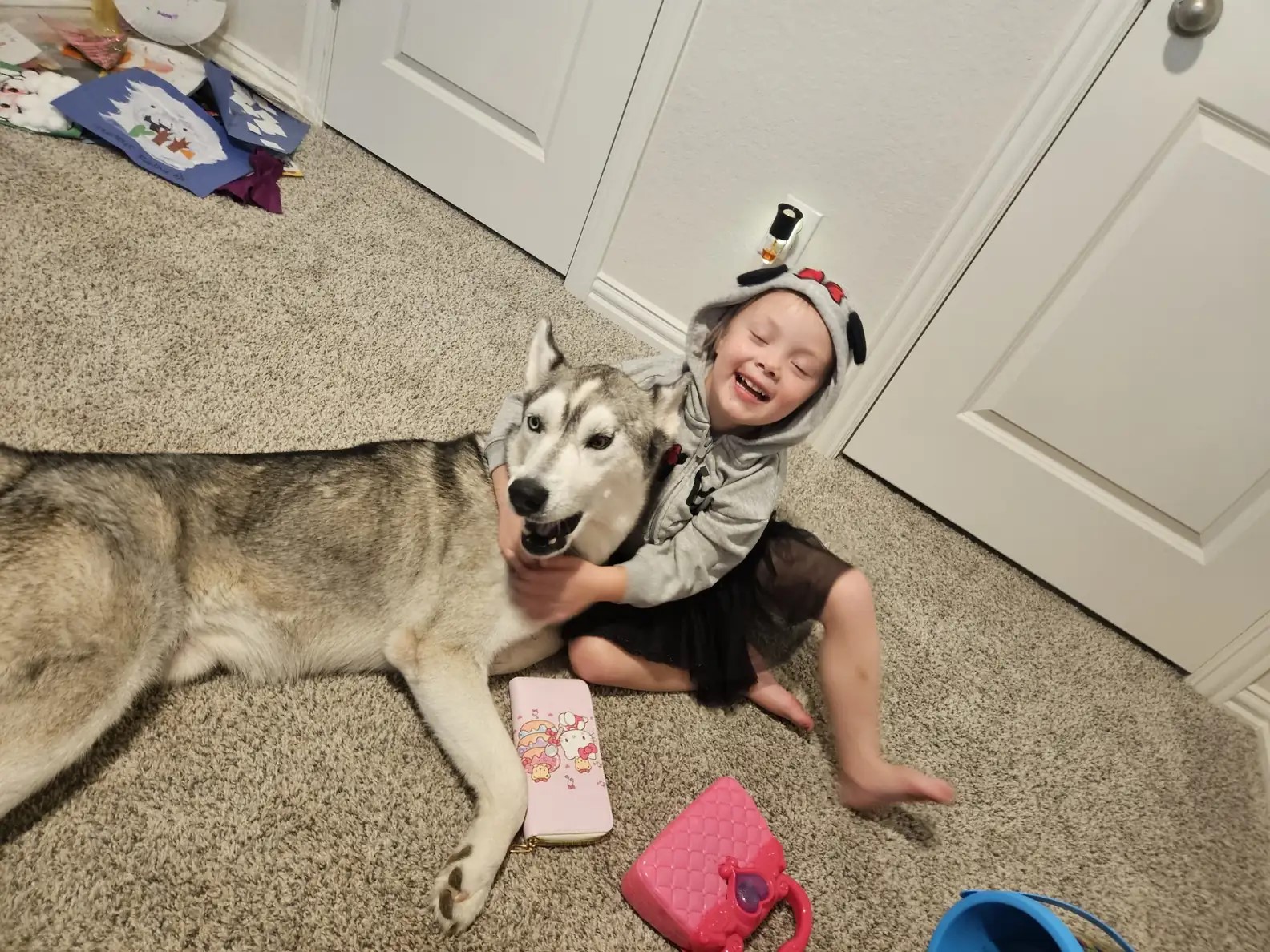 little boy smiling with husky