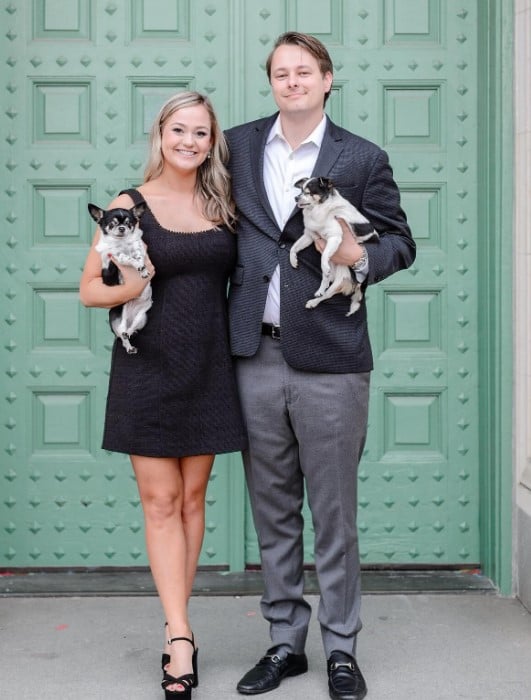 a man and a woman take a picture with two small drinks in their hands