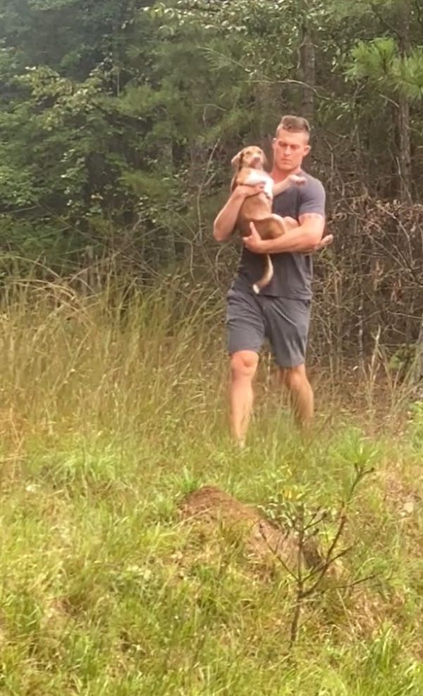 man and scared puppy