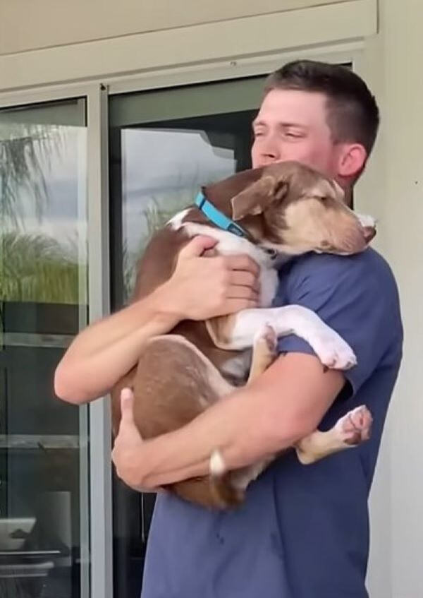 man holding a dog