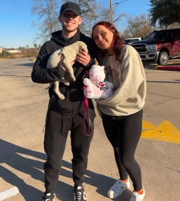 couple and puppy