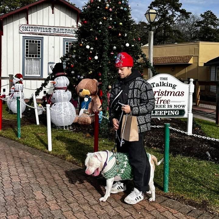 man and his white dog