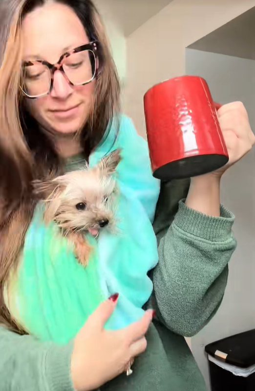 woman holding a dog