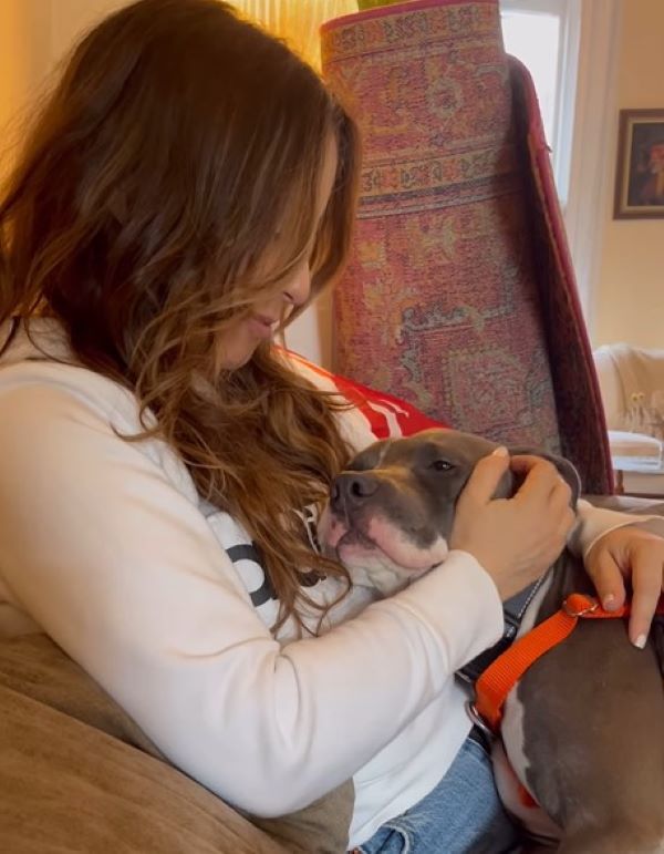 woman playing with her dog